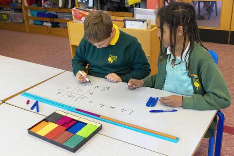 Pupils studying long multiplication